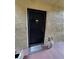 Private condo entrance with a black door and a welcome mat at 107 S Obrien St # 220, Tampa, FL 33609