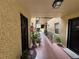 Shared hallway with plants and access to individual condo units at 107 S Obrien St # 220, Tampa, FL 33609