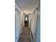 Bright hallway with light wood-look flooring and neutral walls at 107 S Obrien St # 220, Tampa, FL 33609