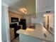 Modern kitchen with light wood cabinets and black appliances at 107 S Obrien St # 220, Tampa, FL 33609