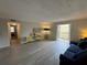 Spacious living room featuring a comfy sofa and access to a balcony at 107 S Obrien St # 220, Tampa, FL 33609