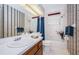 Well-lit bathroom with a single sink vanity and a shower-tub combination at 113 Lindsay Ln # 23, Oldsmar, FL 34677