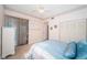 Comfortable bedroom with tile floors, a ceiling fan, and ample natural light at 113 Lindsay Ln # 23, Oldsmar, FL 34677