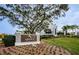 Sign for Ardea Country Club with lush landscaping and elegant architectural details at 113 Lindsay Ln # 23, Oldsmar, FL 34677