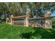 Stone monument at East Lake Woodlands, a country club community, set in manicured landscaping at 113 Lindsay Ln # 23, Oldsmar, FL 34677