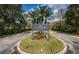 Entrance to the community of St. Andrews with meticulously landscaped grounds and clear signage at 113 Lindsay Ln # 23, Oldsmar, FL 34677
