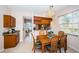 Cozy dining area with chandelier and natural light next to a pass through to the kitchen at 113 Lindsay Ln # 23, Oldsmar, FL 34677