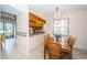 Cozy dining area with chandelier and natural light next to a pass through to the kitchen at 113 Lindsay Ln # 23, Oldsmar, FL 34677