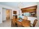 Cozy dining area with chandelier and natural light next to a pass through to the kitchen at 113 Lindsay Ln # 23, Oldsmar, FL 34677