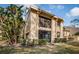 Attractive two-story condo featuring a private balcony surrounded by lush, mature landscaping at 113 Lindsay Ln # 23, Oldsmar, FL 34677