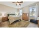 Spacious bedroom with wood furniture and neutral decor at 11575 Captiva Kay Dr, Riverview, FL 33569