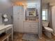 A well-lit bathroom offers a spacious vanity, ample storage, and modern fixtures for added convenience at 117 S Saint Thomas Cir, Apollo Beach, FL 33572