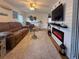 Inviting living room featuring a fireplace, comfortable seating, and a nautical theme at 117 S Saint Thomas Cir, Apollo Beach, FL 33572