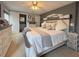 A serene main bedroom features a coastal-inspired decor, plush bedding, and an en-suite bathroom at 117 S Saint Thomas Cir, Apollo Beach, FL 33572
