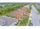 Aerial view of townhomes with well-manicured lawns and lush landscaping at 11811 Meadowgate Pl, Bradenton, FL 34211