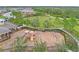 Aerial view of the community playground with slides, swings, and climbing features, great for families at 11811 Meadowgate Pl, Bradenton, FL 34211