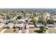 Aerial view of the property showcasing the neighborhood and surrounding trees at 1198 Channing Ave, Spring Hill, FL 34608