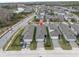 Aerial view of the neighborhood featuring charming homes with garages, green lawns and mature landscaping at 12099 Gavin Ln, Odessa, FL 33556
