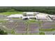 Aerial view of school with large building complex, parking, and green space at 12099 Gavin Ln, Odessa, FL 33556