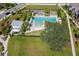 Aerial view of the community pool and surrounding green space, showcasing the amenity and its lush environment at 12099 Gavin Ln, Odessa, FL 33556