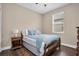 Traditional bedroom featuring a full bed with a vintage wood frame, plus a ceiling fan at 12099 Gavin Ln, Odessa, FL 33556