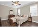 Comfortable bedroom features a ceiling fan and plenty of closet space at 12099 Gavin Ln, Odessa, FL 33556