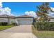 Charming single-Gathering home featuring a spacious two-car garage and meticulously maintained landscaping at 12099 Gavin Ln, Odessa, FL 33556