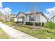 Beautiful single-story home with manicured front yard landscaping, green lawn, and sidewalk at 12099 Gavin Ln, Odessa, FL 33556