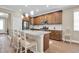 Spacious kitchen with a large center island, stainless steel appliances, and pendant lighting at 12099 Gavin Ln, Odessa, FL 33556