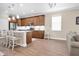 Bright and airy kitchen with stainless steel appliances, island seating, and an open floor plan at 12099 Gavin Ln, Odessa, FL 33556