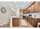 Modern kitchen featuring granite countertops, stainless steel appliances, and ample cabinet space at 12099 Gavin Ln, Odessa, FL 33556