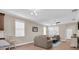 Cozy living room featuring lots of seating with a view of the kitchen at 12099 Gavin Ln, Odessa, FL 33556