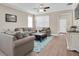 Open living room boasts natural light, neutral tones and wood flooring at 12099 Gavin Ln, Odessa, FL 33556
