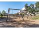Playground with swings, wood chip ground cover, and a nearby home at 12099 Gavin Ln, Odessa, FL 33556