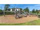 Community playground with wooden climbing structures, perfect for outdoor fun at 12099 Gavin Ln, Odessa, FL 33556
