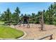 Modern playground featuring a see saw, climbing ropes and wood chip ground covering at 12099 Gavin Ln, Odessa, FL 33556