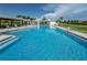 Large pool, perfect for swimming, featuring steps, ladders, and a clear blue surface at 12099 Gavin Ln, Odessa, FL 33556