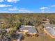 Aerial view of the home showcasing its large lot, driveway, mature trees, and proximity to neighborhood at 1276 Bermuda St, Clearwater, FL 33755