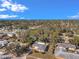 Expansive aerial view of a charming neighborhood with mature trees, showcasing the home's desirable location near the water at 1276 Bermuda St, Clearwater, FL 33755