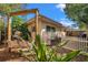 Backyard featuring a swing set, white picket fence, and partial view of house at 1276 Bermuda St, Clearwater, FL 33755