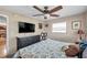 Bedroom with a ceiling fan, large windows, and an airy atmosphere. Ready for relaxation or customization at 1276 Bermuda St, Clearwater, FL 33755