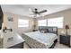 Cozy bedroom featuring a ceiling fan, natural light, and tasteful decor, creating a peaceful retreat at 1276 Bermuda St, Clearwater, FL 33755
