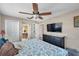 Comfortable bedroom with a large ceiling fan, TV on the wall, and closet for ample storage at 1276 Bermuda St, Clearwater, FL 33755