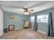 A cozy bedroom that features a ceiling fan, natural light, and neutral walls at 1276 Bermuda St, Clearwater, FL 33755