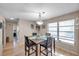 Cozy dining area with a modern chandelier, large window, and inviting atmosphere at 1276 Bermuda St, Clearwater, FL 33755