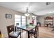 Inviting dining area with stylish lighting and a window offering natural light at 1276 Bermuda St, Clearwater, FL 33755