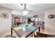 Open-concept dining area featuring hardwood floors and an elegant light fixture at 1276 Bermuda St, Clearwater, FL 33755