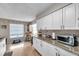 Bright and airy kitchen with granite countertops, stainless appliances, and ample cabinet space at 1276 Bermuda St, Clearwater, FL 33755