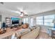 Comfortable living room with large windows and a ceiling fan at 1276 Bermuda St, Clearwater, FL 33755