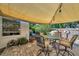 Cozy brick patio with shade covering, outdoor furniture, and privacy fencing, perfect for relaxing or entertaining guests at 1276 Bermuda St, Clearwater, FL 33755